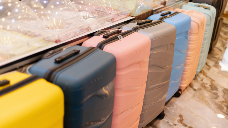 Brightly colored suitcases arranged in a store