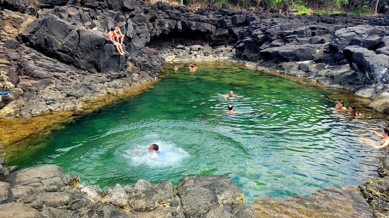 People swimming at Queen's Bath