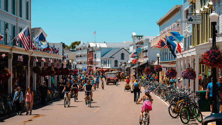 Bicyclists riding through street in downtown Mackinac Island