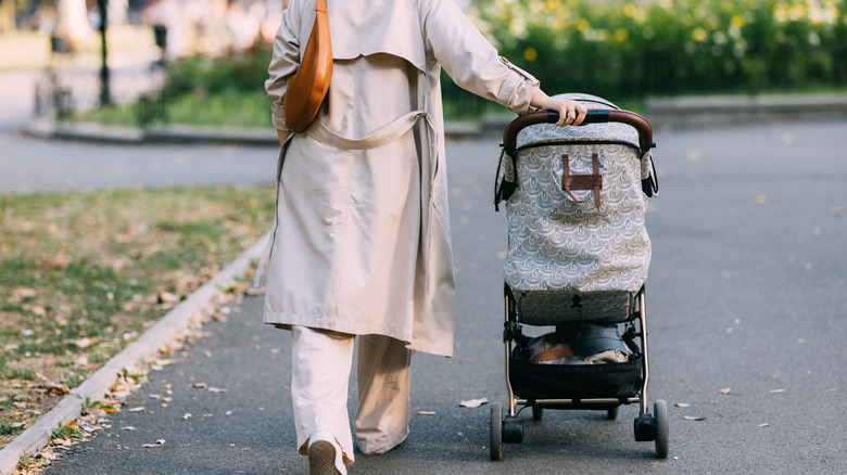 Woman pushing a baby stroller
