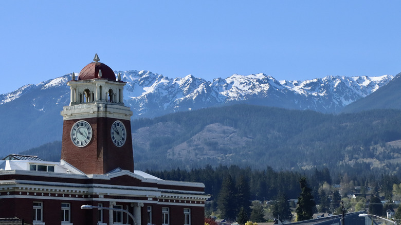 Port Angeles courthouse in foreground with snowy mountain peaks