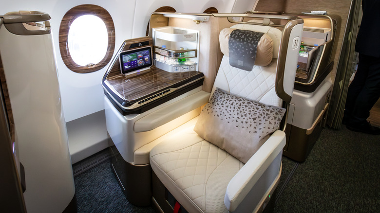 Luxe cream and wood veneer First Class seat in the Emirates Airbus A350 aircraft at the Paris Air Show