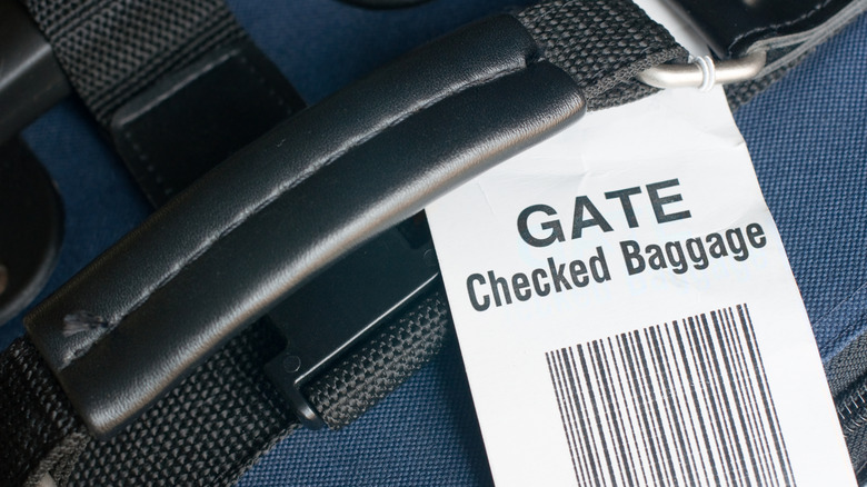 Checked baggage tag on a suitcase