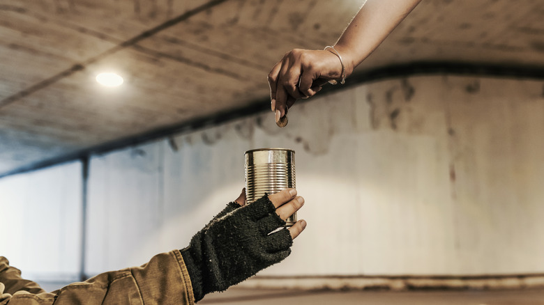 Beggar with cup