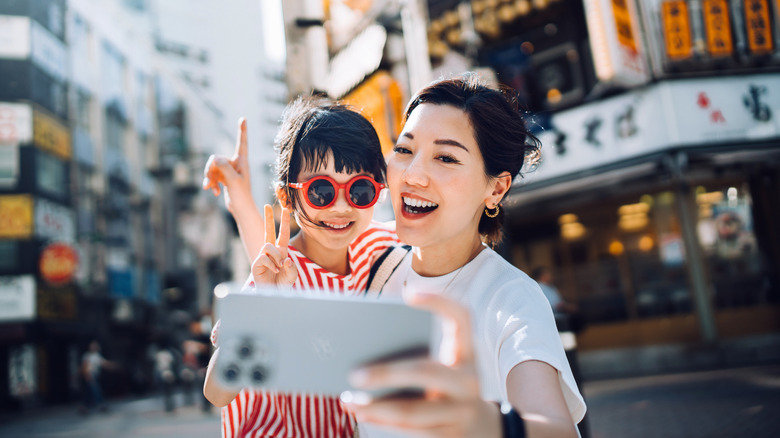 Mother and daughter take selfie