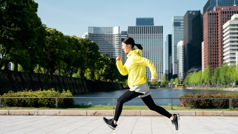 Woman running in city