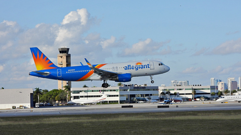 An Allegiant Airbus A320-214 fixed wing multi engine landing at the Ft. Lauderdale Hollywood Airport.