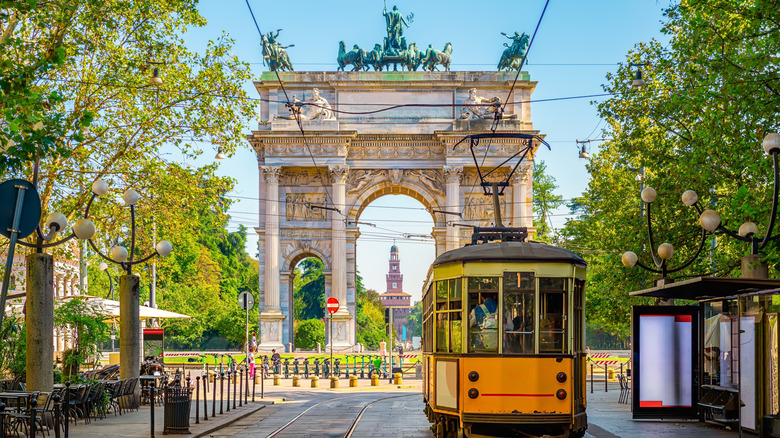View of the Peace Arch with yellow tram in Milan