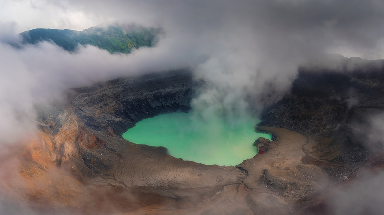 The vibrant lake at the center of Poás Volcano in Costa Rica.
