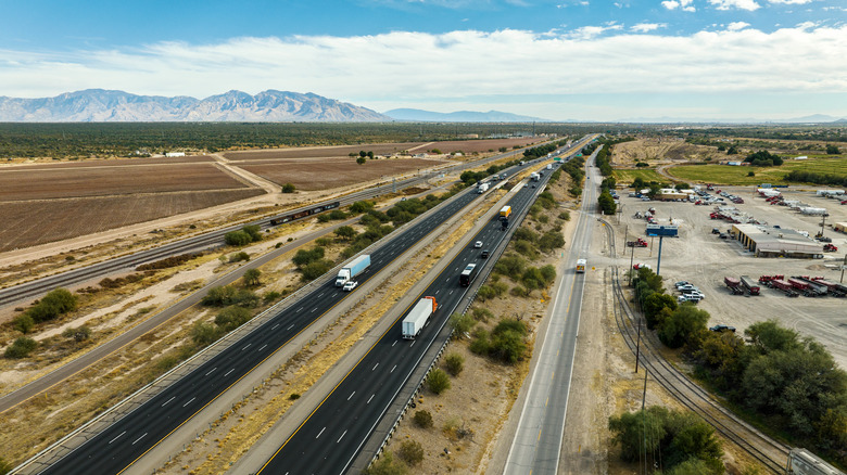 vehicles travel on I-10 in Arizona across the desert.
