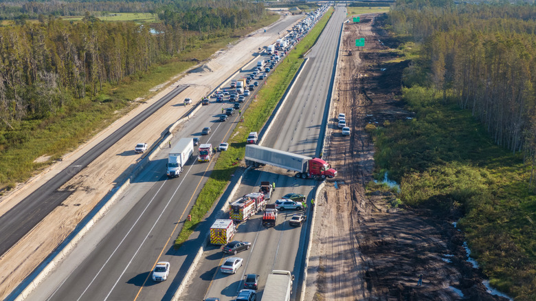A crashed truck lies across the I4 Eastbound shutting down freeway