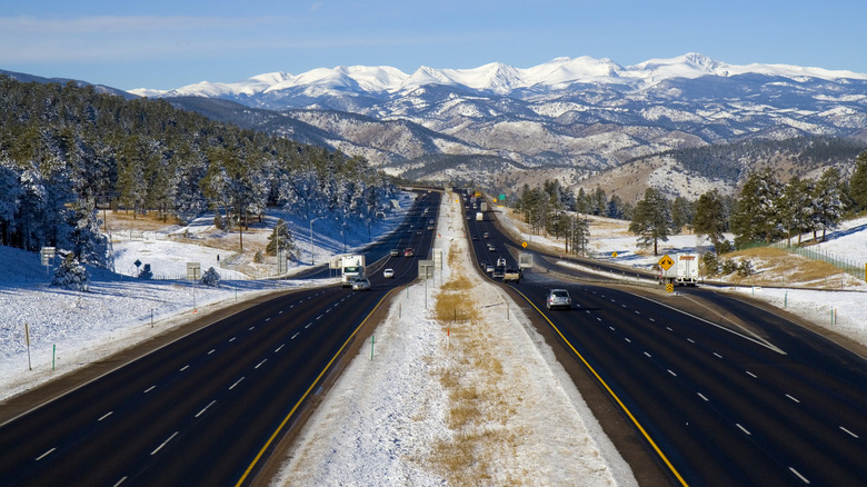 Snow covers the landscape surrrounding I-75 facing west towards the Rocky Mountains