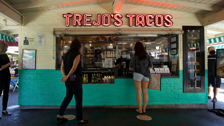 People ordering food at Trejo's Tacos