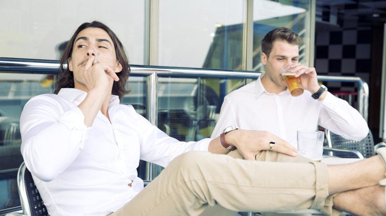 Man smoking with a friend