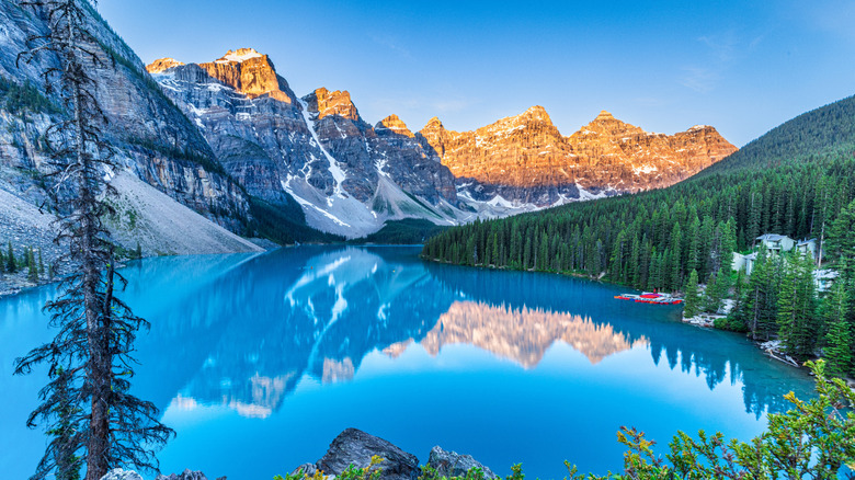 Turquoise waters of Lake Moraine surrounded by mountains in Canada