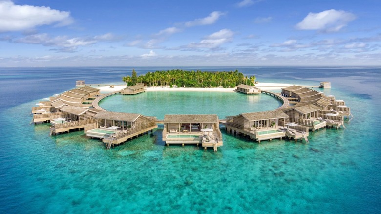 Aerial view of overwater villas at Kudadoo