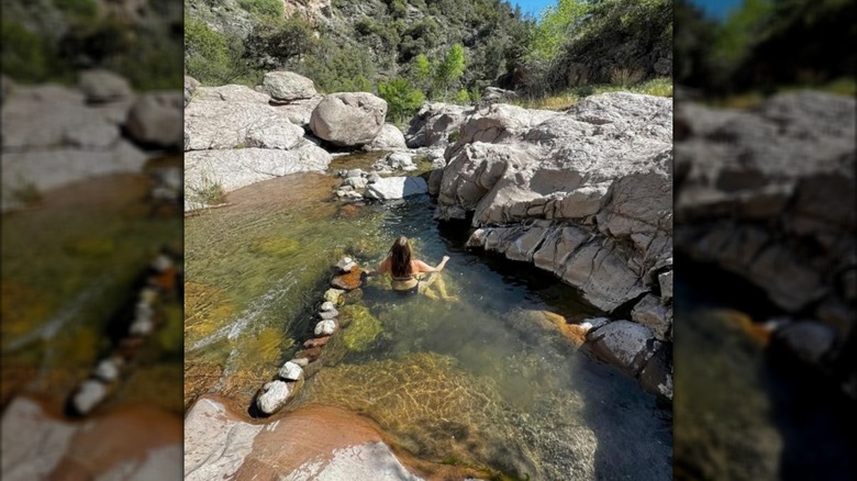 A woman in Turkey Creek Hot Springs in the Gila Wilderness in New Mexico