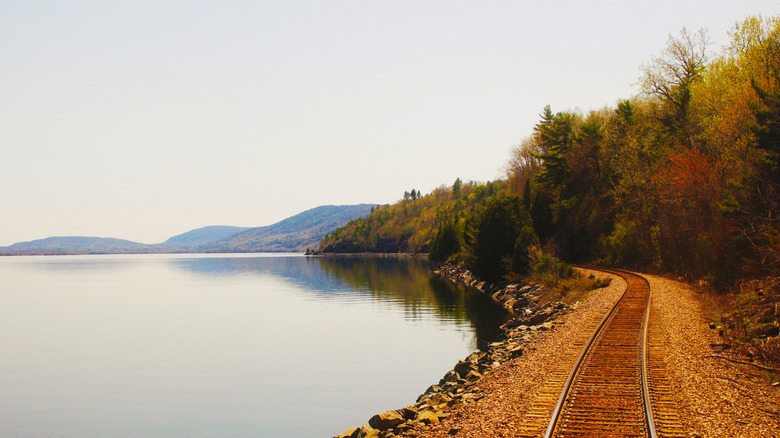Railroad tracks seen from the back of an Adirondack train heading to Montreal, Canada, from New York, USA.