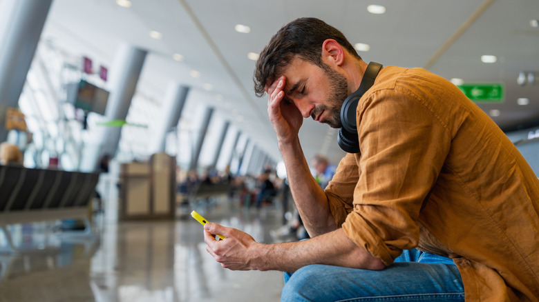 Frustrated passenger in an airport terminal