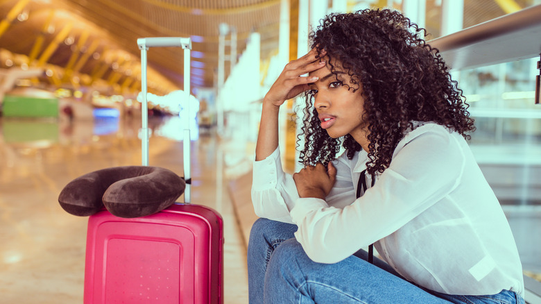 Stressed woman at airport
