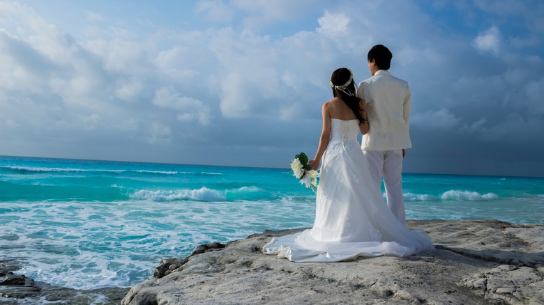 Couples marrying on a beach