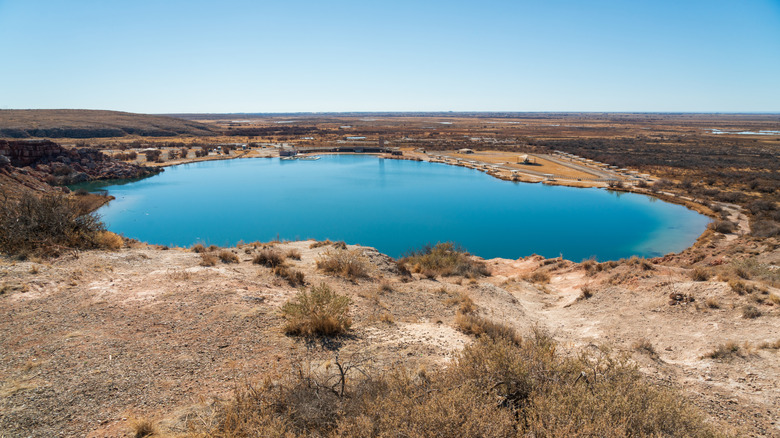 An elevated view of a sinkhole that has become a lake at Bottomless Lakes State Park, New Mexico