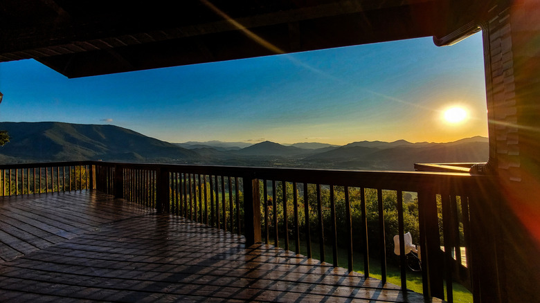 A sunrise over the mountains, viewed from the porch of a cabin in Wears Valley