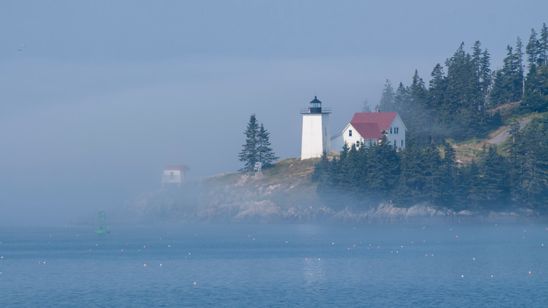 Burnt Coat Harbor Lighthouse on Swan's Island, Maine as seen in the fog.