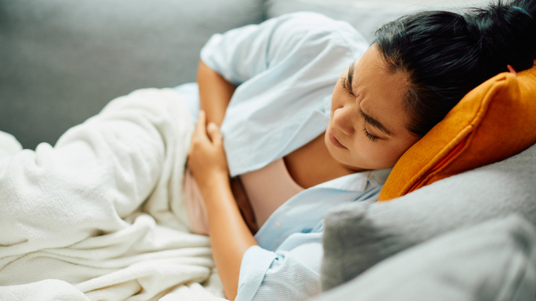 An ill woman on a couch