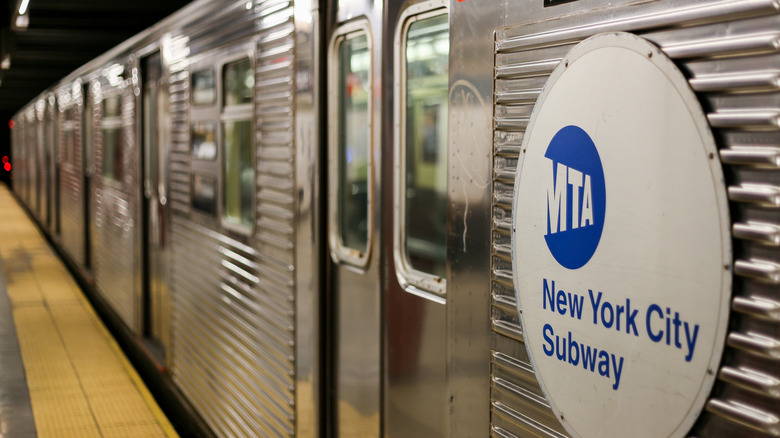 A subway station with the "MTA New York City Subway" sign