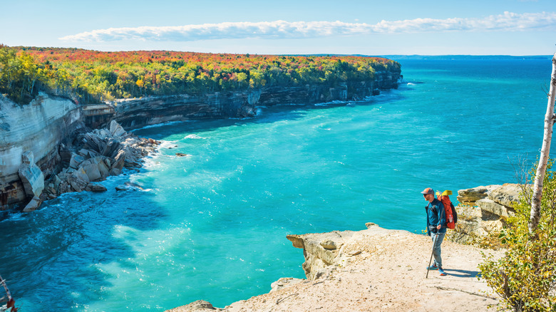 A man hikes the Chapel Loop Trail at Pictured Rocks National Lakeshore, Michigan