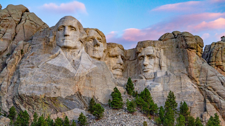 The faces of Mount Rushmore with soft sunrise clouds, South Dakota