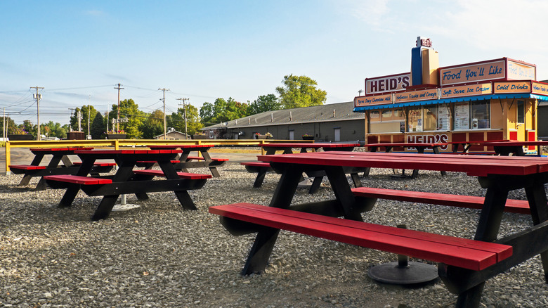Red picnic tables in front of Heid's of Liverpool restaurant.