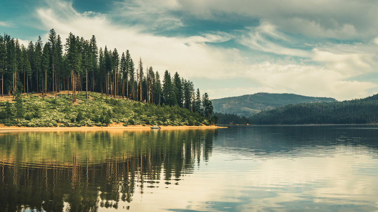 Boat on the shore of Butt Valley Reservoir in California