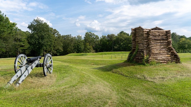 A cannon and a log rifle tower at the Ninety Six National Historic Site in Greenwood, South Carolina