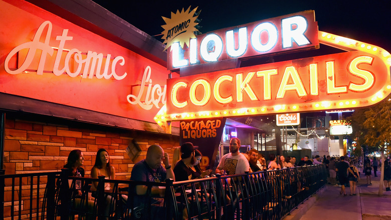 People drinking outside at the Atomic Liquor bar in Las Vegas