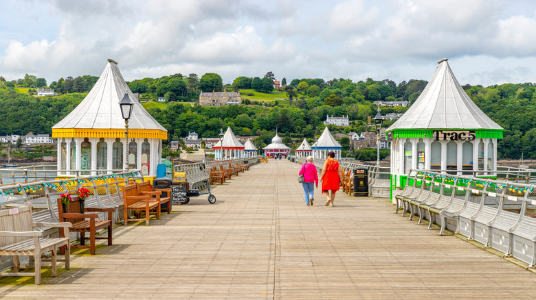 Colorful buildings on the Garth Pier with water on the edges