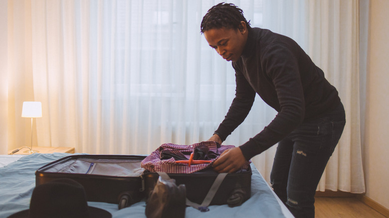 Man packing luggage