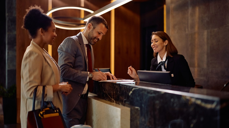 Couple checking in to a hotel