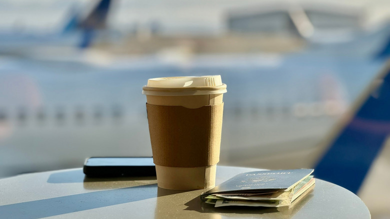 A takeaway coffee cup at an airport