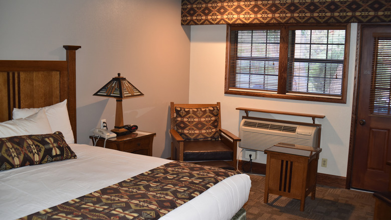 king-sized bed in rustic lodge