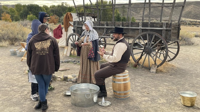 Pioneers doing a gold panning demonstration at the Three Island Crossing State Park