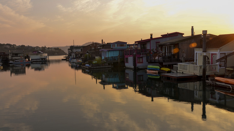 Buildings along Waldo Point Harbor at sunset
