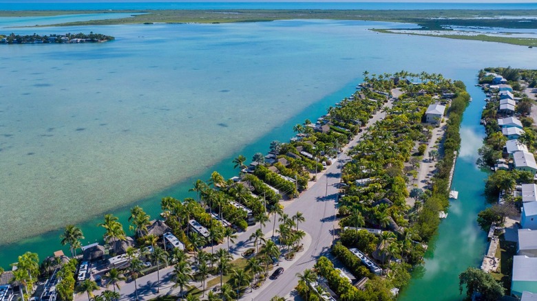 Bluewater Key Resort with palm trees surrounded by blue Florida Keys water