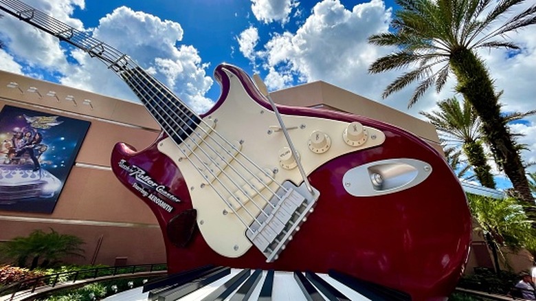 The iconic red Aerosmith guitar in front of the entrance of the Rock 'n' Roller Coaster