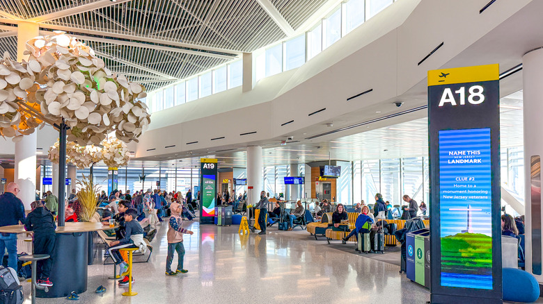 Travelers lounging inside EWR Airport