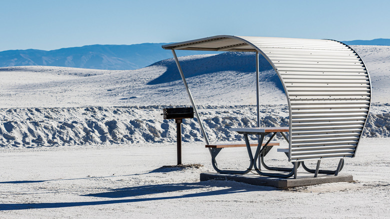 A covered picnic table in the Yucca Picnic Area at White Sands National Park in New Mexico