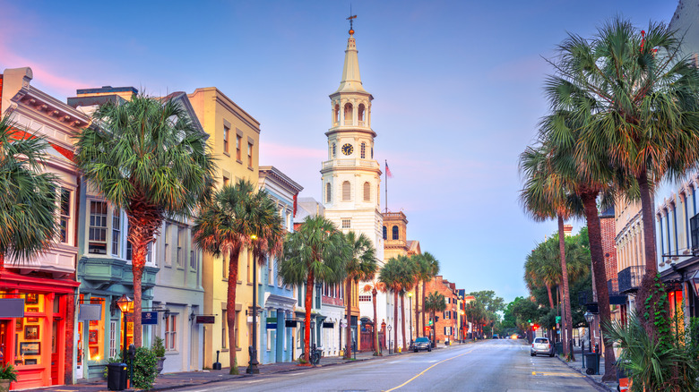 A colorful street lined with trees and building in Charleston, South Carolina