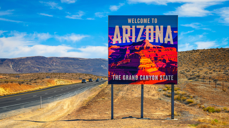 Welcome to Arizona sign along the highway in the desert