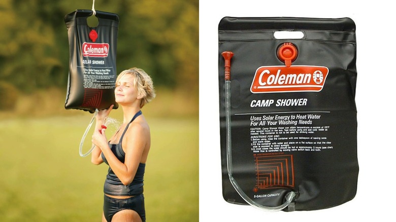 A relaxed woman showers outdoor with a portable solar shower from Coleman.